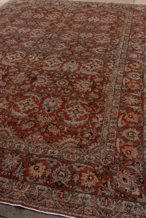 Antique Persian Tabriz with Floral Medallion Design in Rich Earth Tones