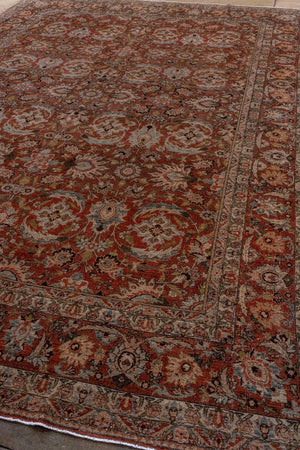 Antique Persian Tabriz with Floral Medallion Design in Rich Earth Tones